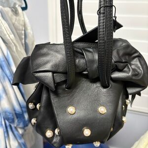 Elegant Black Leather Bag with Pearl Accents
